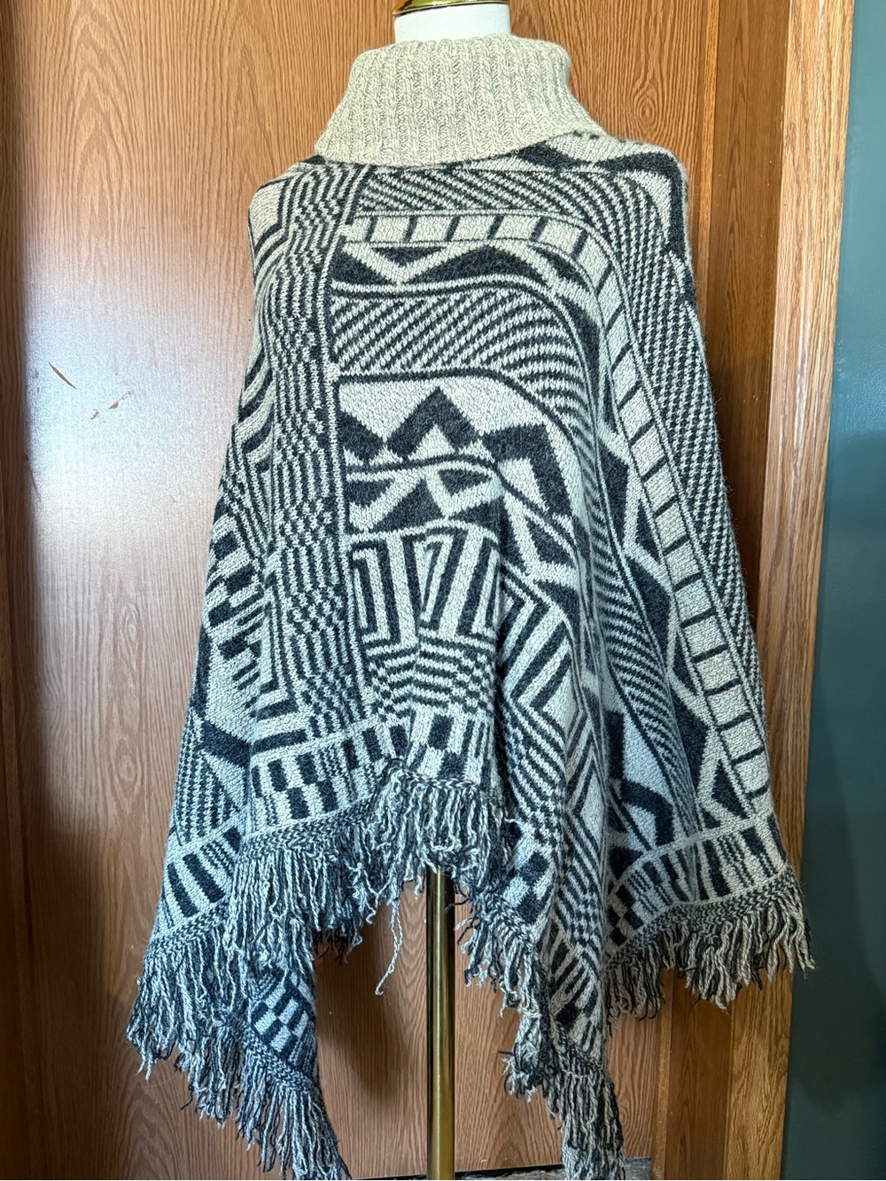 Geometric Pattern Turtleneck Fringe Poncho Cape in Black & Cream